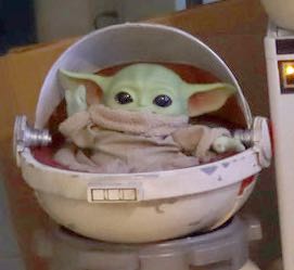 A pram for Grogu made from a cat carrier backpack